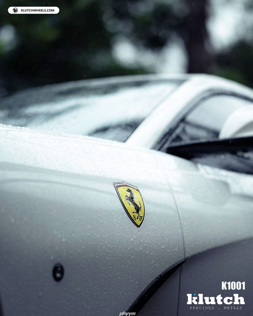 Ferrari fender badge and Klutch K1001 wheel in the rain.