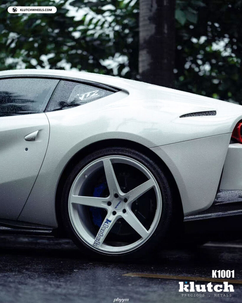 Ferrari 812 with Klutch K1001 forged wheels parked on wet forest road